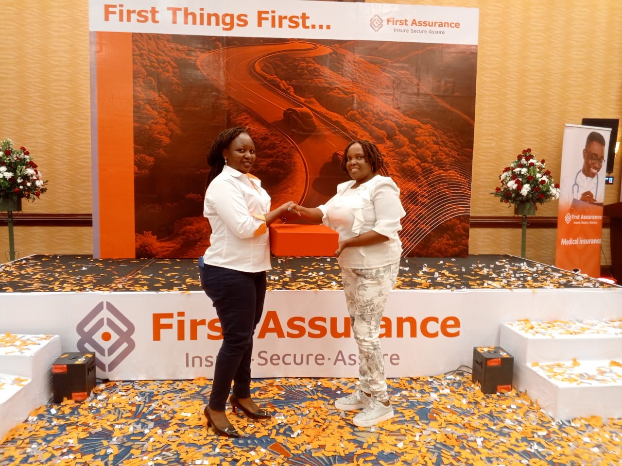 Maggie receiving award from First Assurance